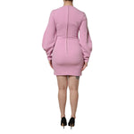 Back view of Dolce & Gabbana Pink Polyester Long Sleeves Sheath Mini Dress on model, showcasing zipper closure.