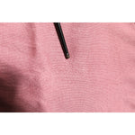 Detail of Dolce & Gabbana Pink Silk Cropped Crew Neck Cardigan Sweater showing fabric texture and pulled threads.