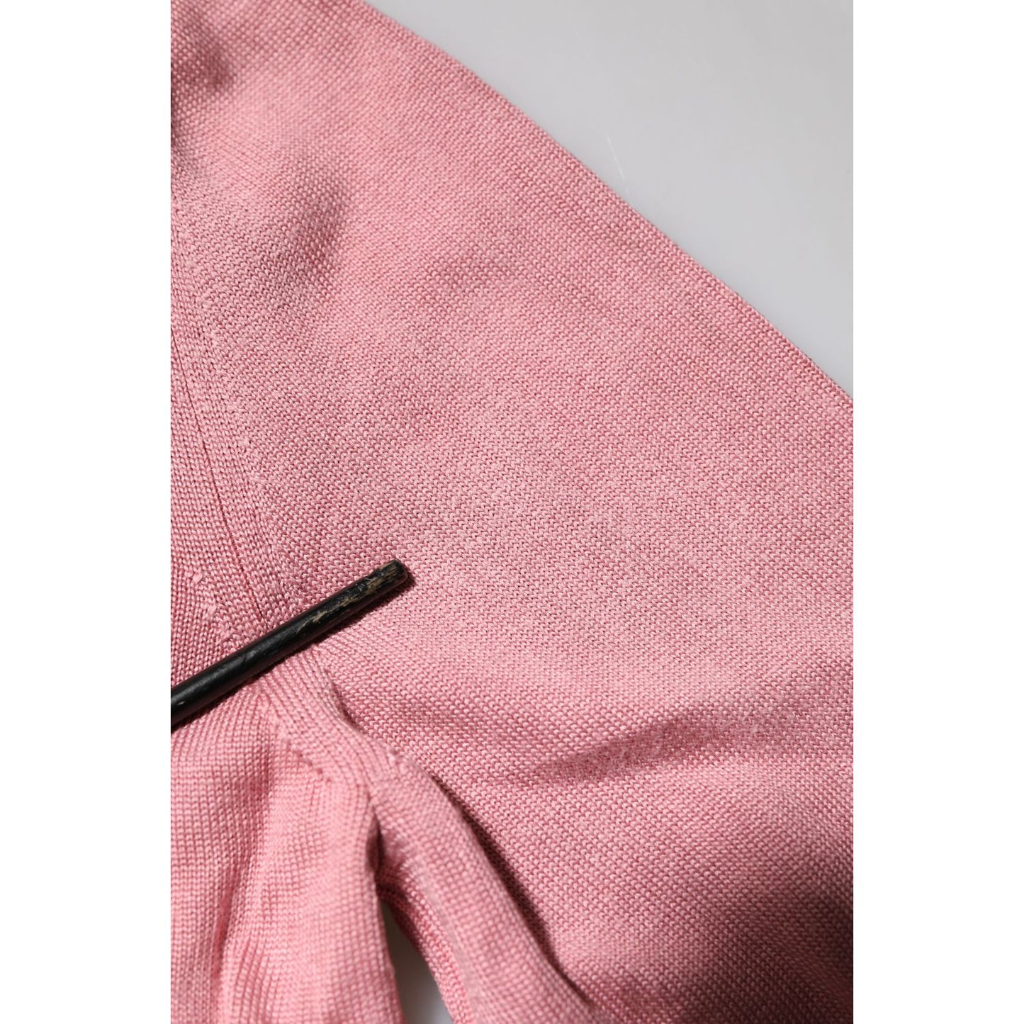 Detail of Dolce & Gabbana Pink Silk Cropped Crew Neck Cardigan Sweater showing pulled threads on front