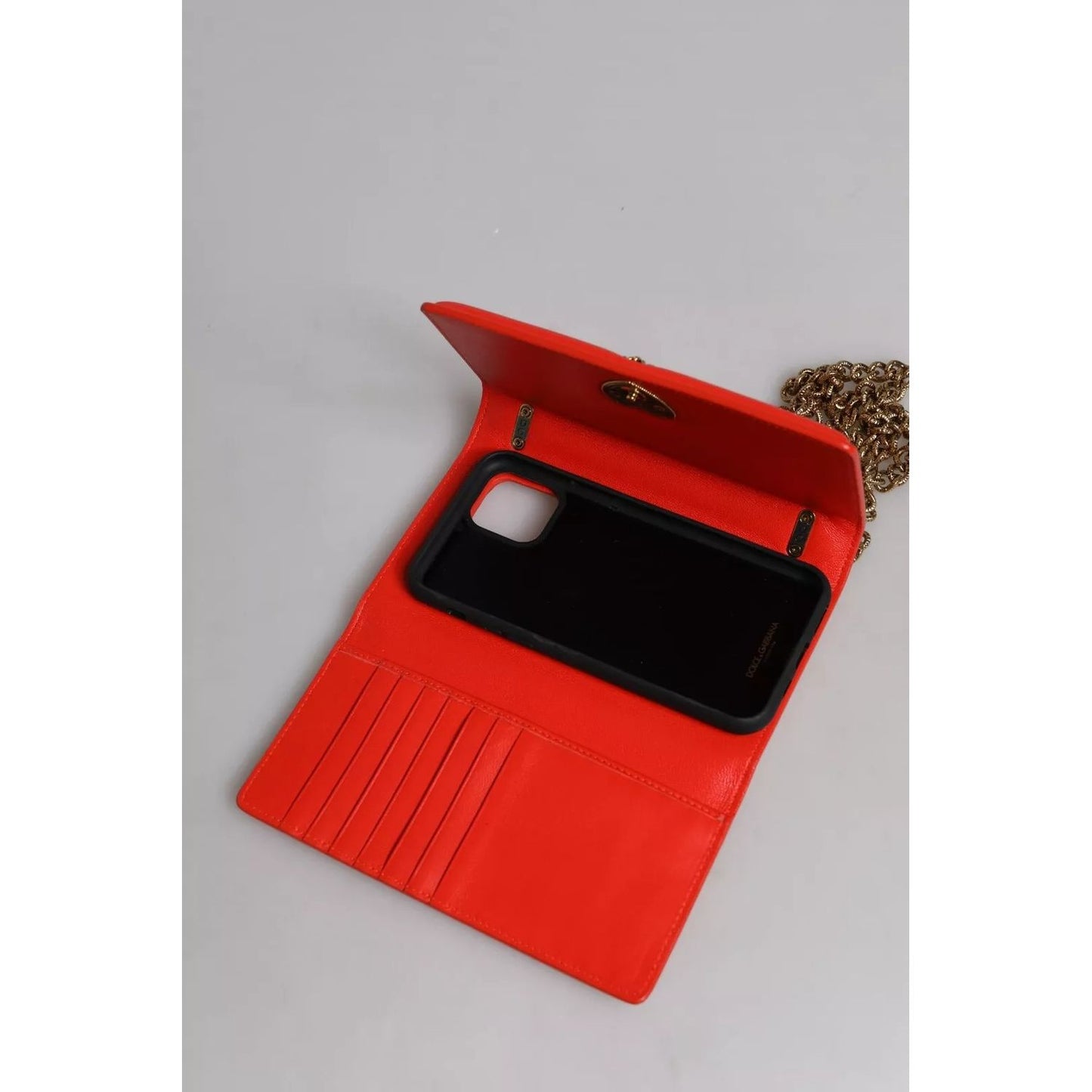 Open Dolce & Gabbana Red Quilted Devotion Crossbody 11 PRO Phone case bag showing interior compartments and chain strap.