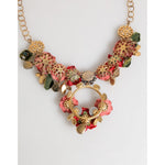 Dolce & Gabbana Red Rose Floral Crystal Embellished Statement Jewelry Necklace with gold and green accents displayed on white background.