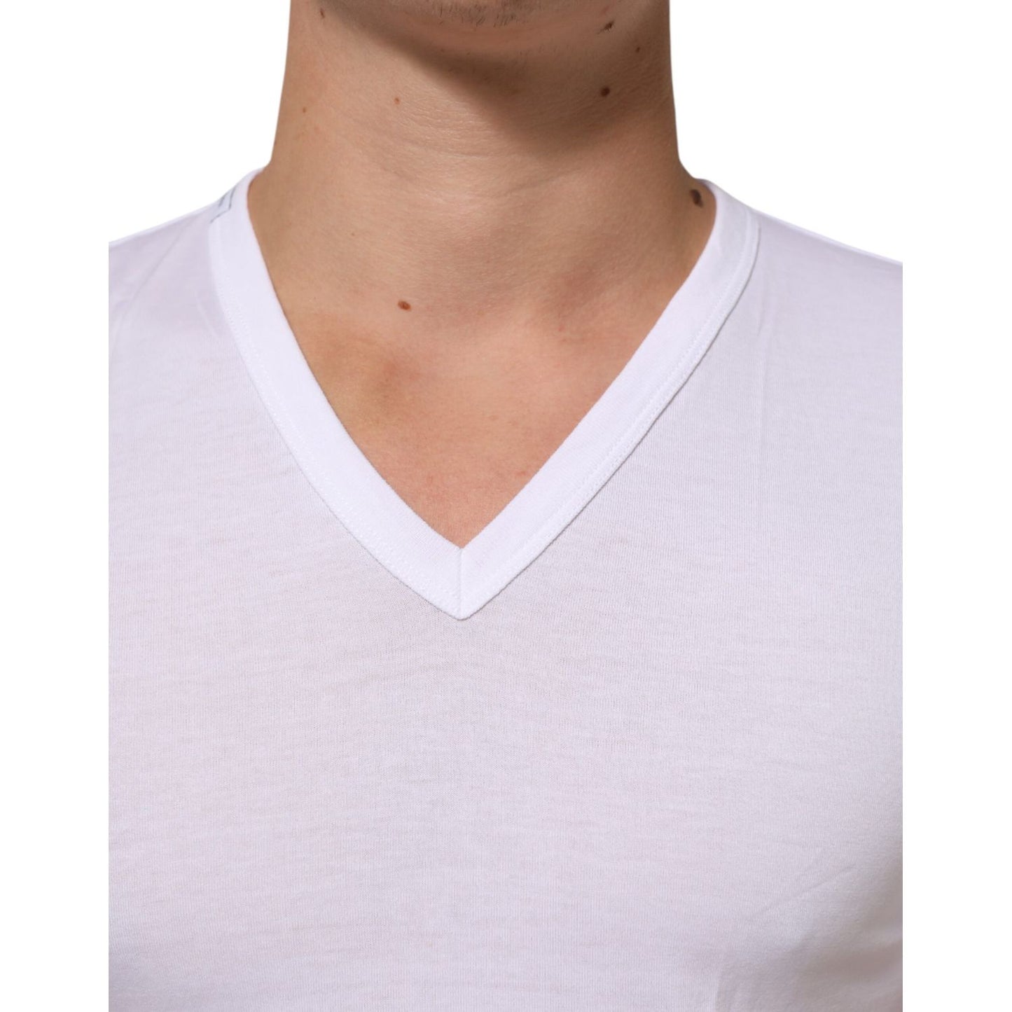 Dolce & Gabbana White Cotton V-Neck Short Sleeves T-shirt on model, showcasing classic neckline and soft cotton fabric.