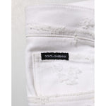 Detail of Dolce & Gabbana White Distressed Ripped Denim Trouser Jeans with label