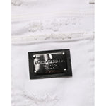 Dolce & Gabbana White Distressed Ripped Denim Trouser Jeans with metal brand logo patch detail.