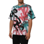 Dolce & Gabbana White Graffiti Crew Neck Short Sleeves T-shirt featuring urban graffiti design, worn by a model, made from 100% cotton.