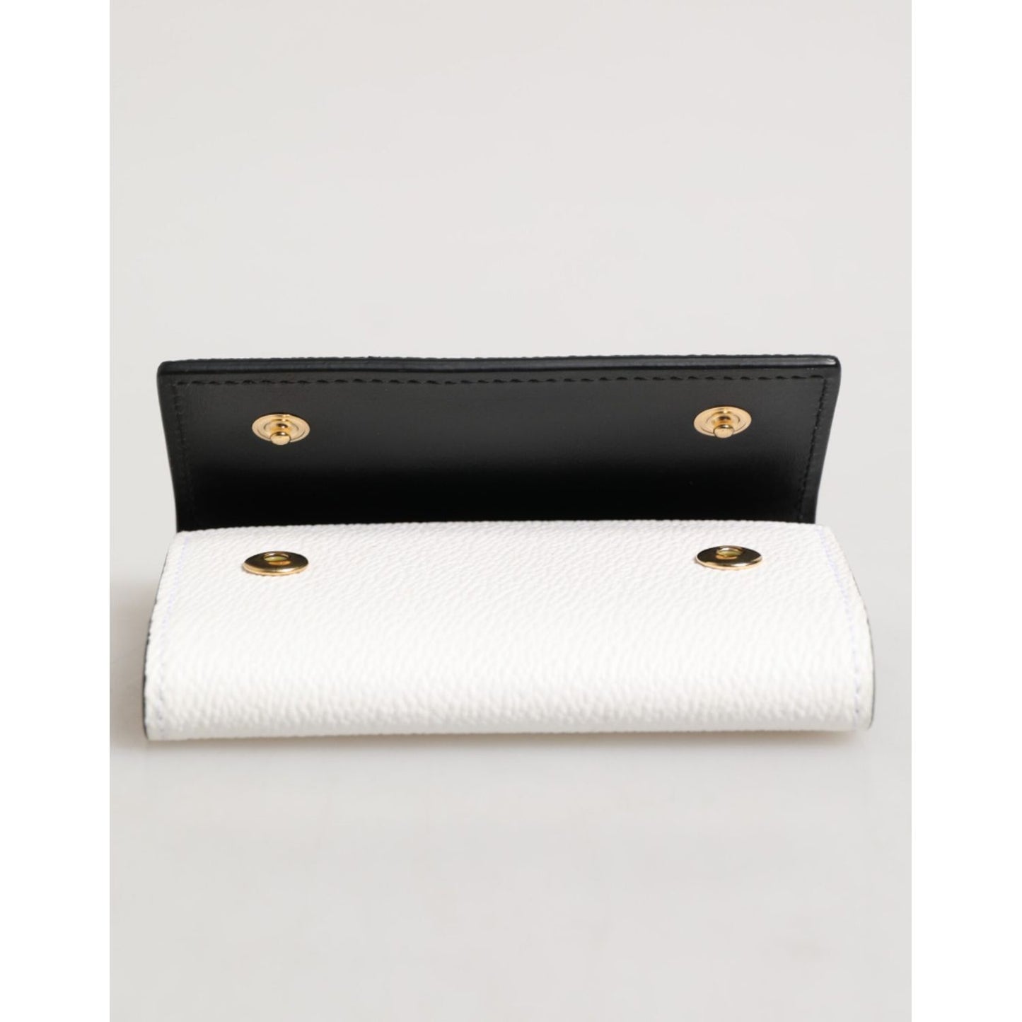 Dolce & Gabbana White Leather Card Case Holder Wallet Gold Logo Plate Key Holder with open view of black interior and snap closures.
