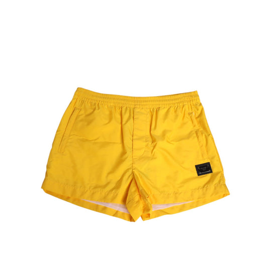 Dolce & Gabbana Yellow Nylon Logo Plaque Boxer Shorts Swimwear with elasticated waistband for stylish summer beach days.