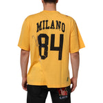 Rear view of Dolce & Gabbana Yellow Secret Graden Floral Cotton CrewNeck T-shirt with Milano 84 print.