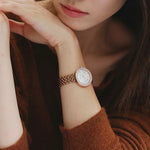 Lady wearing EMPORIO ARMANI MOD. AR11355 wristwatch with stainless steel bracelet, 30mm case, quartz movement, and official box.