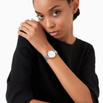 Woman wearing EMPORIO ARMANI MOD. AR11445 wristwatch with stainless steel case and SS bracelet, elegant design for ladies, 32mm.
