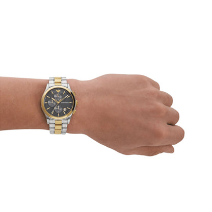 EMPORIO ARMANI Mod. AR11527 watch on male wrist, 5 ATM water resistant, SS IP gold case, mineral dial, luxury men's accessory.