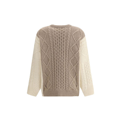 Back view of Ella Cream Cashmere Cashmere Sweater, featuring a two-tone cable-knit design and ribbed accents, made in Italy.
