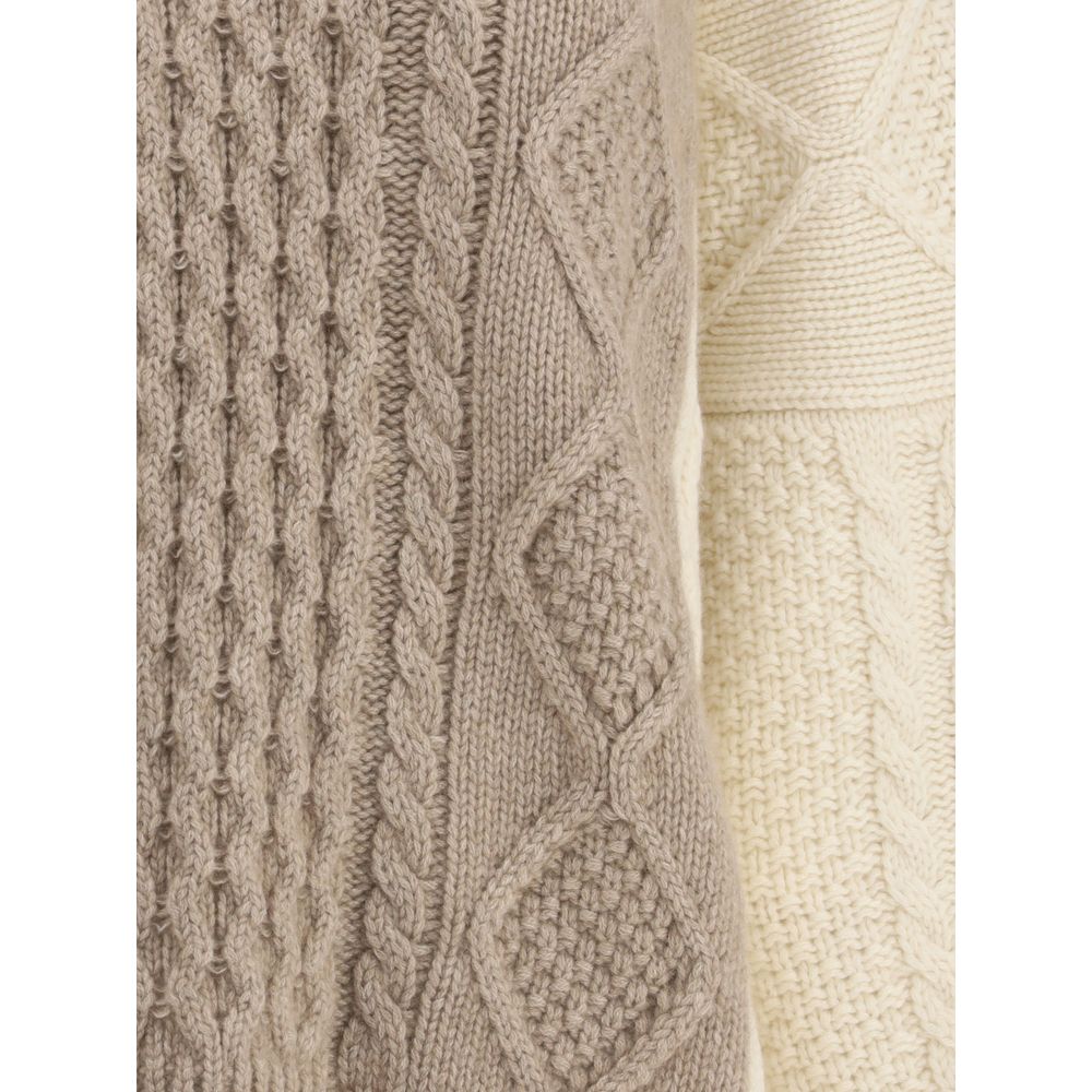 Close-up of Ella Cream Cashmere Cashmere Sweater showing two-tone cable-knit texture and ribbed design. Made in Italy.