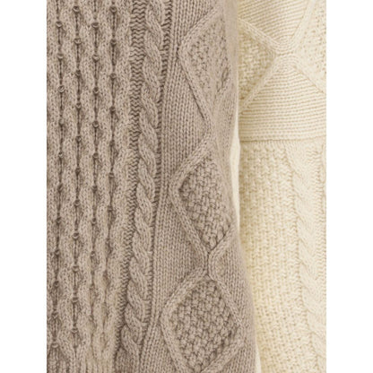 Close-up of Ella Cream Cashmere Cashmere Sweater showing two-tone cable-knit texture and ribbed design. Made in Italy.