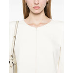 Model wearing Emporio Armani Ottoman-jersey jacket with shoulder pads and white two-way zip fastening, showcasing elegant design.