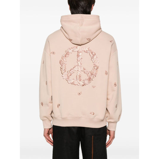 Back view of Emporio Armani Sweaters Powder hoodie in blush pink with peace design, drop shoulder, ribbed cuffs, and organic cotton fabric.