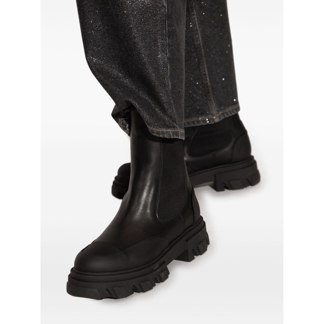 GANNI Boots Black leather Chelsea boots with chunky rubber sole, elasticated side panels, and pull-tab feature for easy slip-on style.
