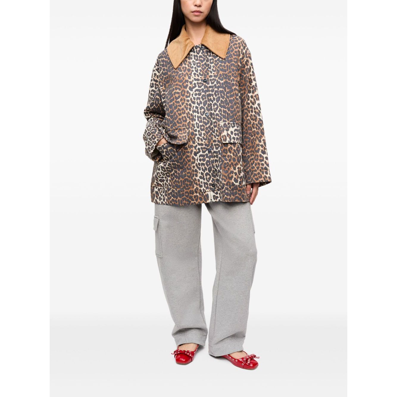 GANNI Jackets Brown with animal print, wide peak lapels, and front button fastening worn with gray pants and red shoes.