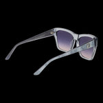 Stylish lady's sunglasses GUESS MOD. GU00113 5520B with elegant gradient lenses and sleek design showcased on a dark background.