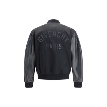 Givenchy Black Cotton Bomber with satin body, leather sleeves, and GIVENCHY Paris logo applique on the back.