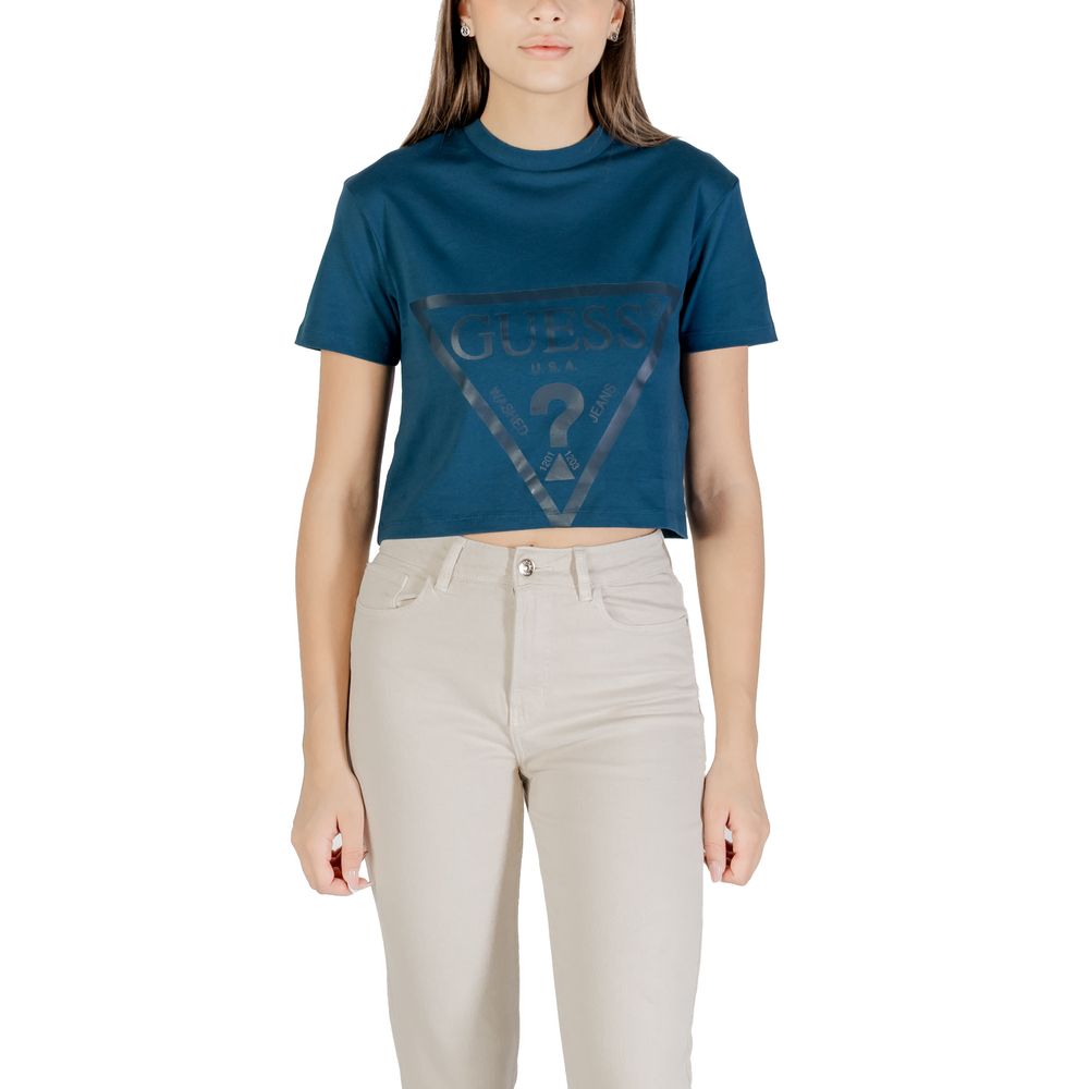 Woman wearing Guess Active Black Cotton Sportswear crop t-shirt with Guess logo, paired with beige pants for a stylish look.
