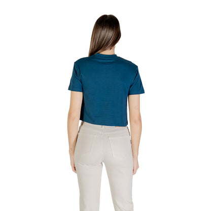 Back view of woman in Guess Active Black Cotton Sportswear cropped t-shirt.
