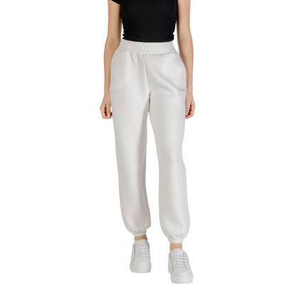 Woman wearing Guess Active Cream Viscose Joggers (Workout Pants), showcasing style and comfort fit for casual and sporty use.