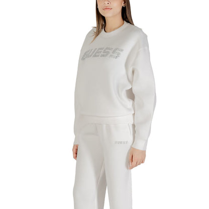Woman wearing Guess Active Cream Viscose Sweatshirt showcasing style and comfort with notable Guess logo, side view.
