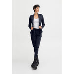 Model wearing ICHI Blue Polyester Pant, showcasing modern style with elastic waistband and front pleats.