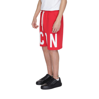 Model wearing Icon Red Cotton Bermuda Shorts with 'ICON' print, drawstring waist, and side pockets for urban style and comfort.