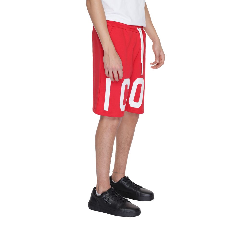 Model wearing Icon Red Cotton Bermuda Shorts with bold ICON print, featuring adjustable drawstring and side pockets.