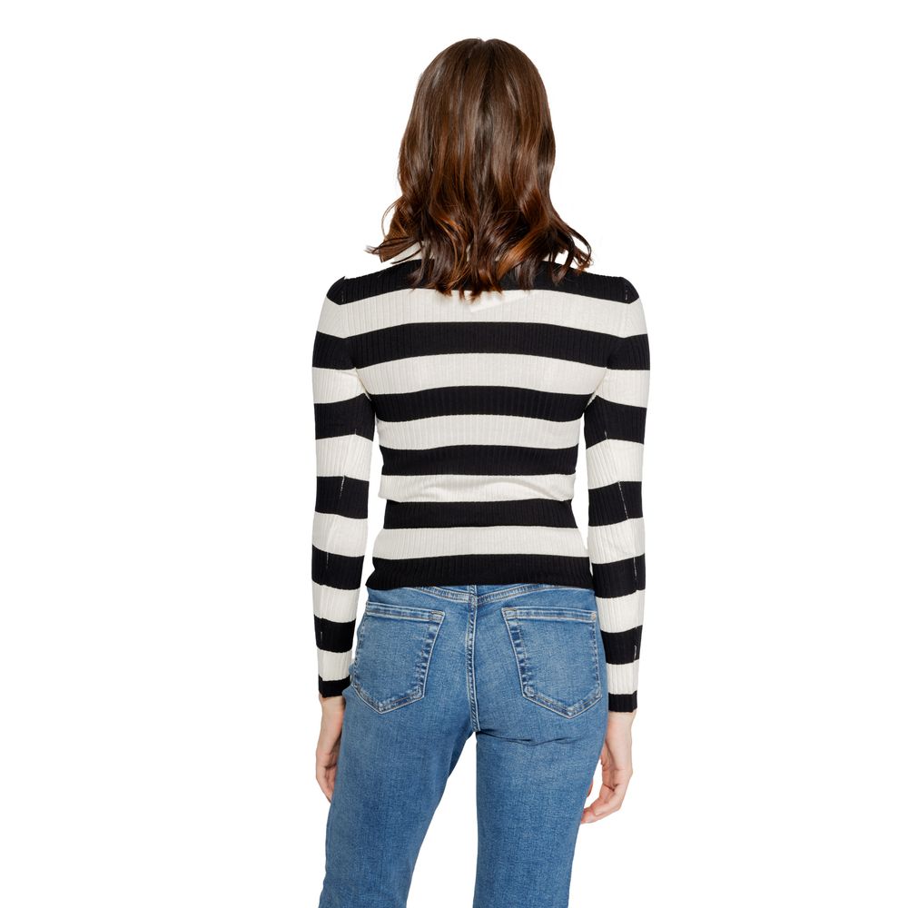Back view of woman wearing Jacqueline De Yong Black Viscose Sportswear, fall/winter knitwear in black, made from viscose blend.