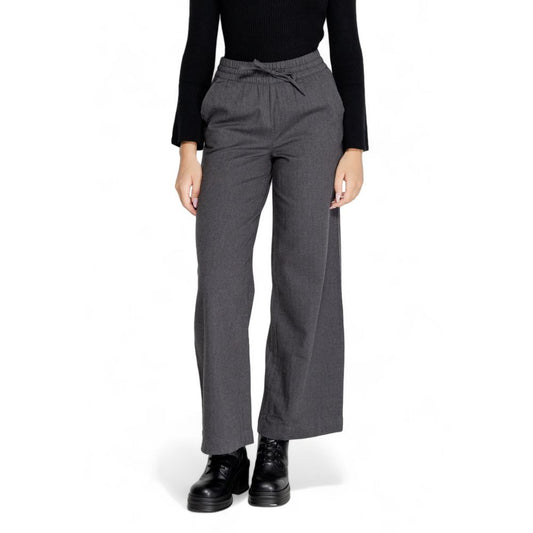 Woman wearing Jacqueline De Yong Gray Cotton Casual Pants, highlighting high waist and wide leg design for elegant comfort.