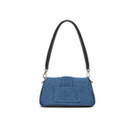 Front view of Jacquemus Denim Le Bambimou Petit Handbag with adjustable strap and silver hardware.