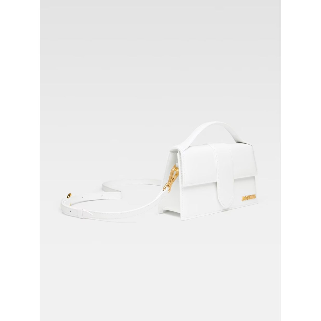 Jacquemus Le Grand Bambino White Bag with gold hardware, leather material, adjustable strap, small handle, and branded logo