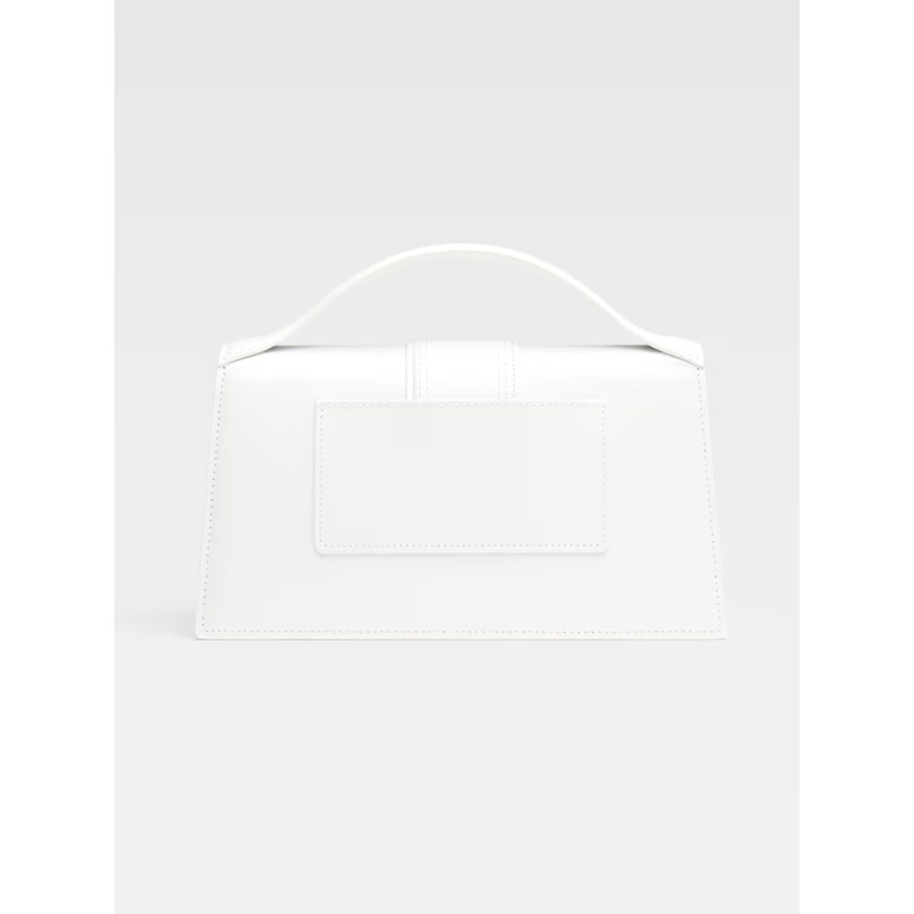 Jacquemus Le Grand Bambino White Bag with gold hardware, adjustable strap, magnetic flap closure, and leather finish, back view.