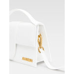 Jacquemus Le Grand Bambino White Bag with gold hardware, leather material, small handle, and adjustable strap.