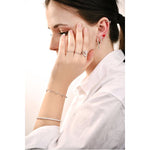 Woman wearing jewelry featuring LA PETITE STORY Mod. LPS02ARQ107 earring made of brass, designed for ladies.