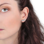Woman wearing LA PETITE STORY Mod. LPS02ARQ29 single brass earring for ladies