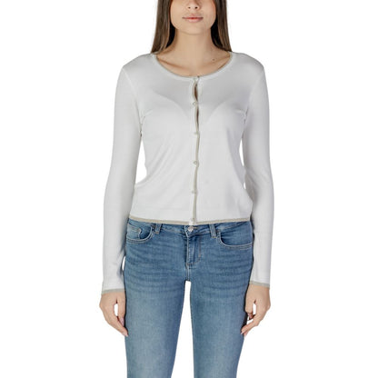 Woman wearing Liu Jo White Viscose Cardigan with jeans, front view, long-sleeved with button closure, essential wardrobe piece.