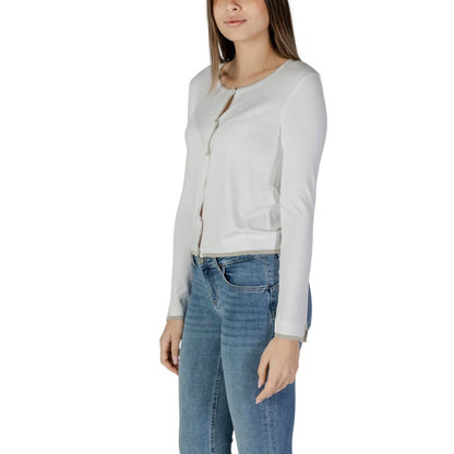 Woman wearing Liu Jo White Viscose Cardigan with long sleeves and button closure, paired with jeans, showcasing elegant fashion style.