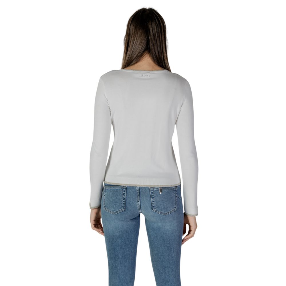 Back view of Liu Jo White Viscose Cardigan worn by a model with denim jeans.