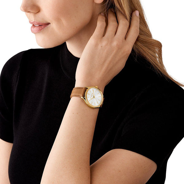 Lady wearing MICHAEL KORS WATCHES Mod. MK7465 wristwatch with 38mm case and official packaging, elegant watch on wrist