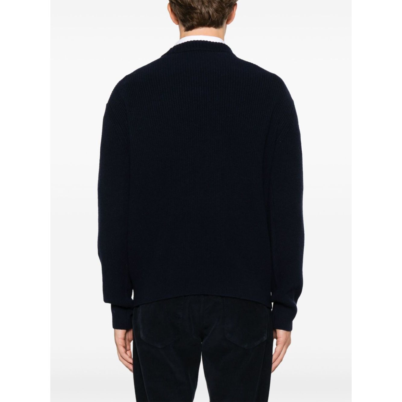 Back view of a person wearing Maison Kitsuné MAISON KITSUNE' Sweaters Blue, featuring oxford blue fisherman's knit and ribbed trim.