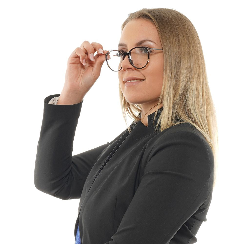 Woman wearing Maje Brown Women Glasses Frame in acetate with round, full-rim style, showcasing elegant eyewear fashion.