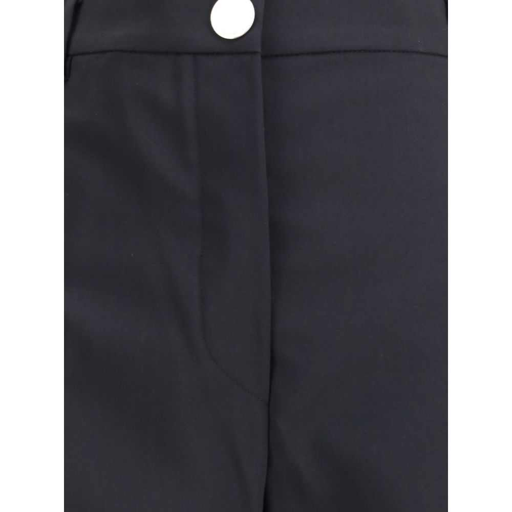 Close-up of Max Mara Black Fleece Wool Casual Pants featuring button closure and sleek fabric detail.