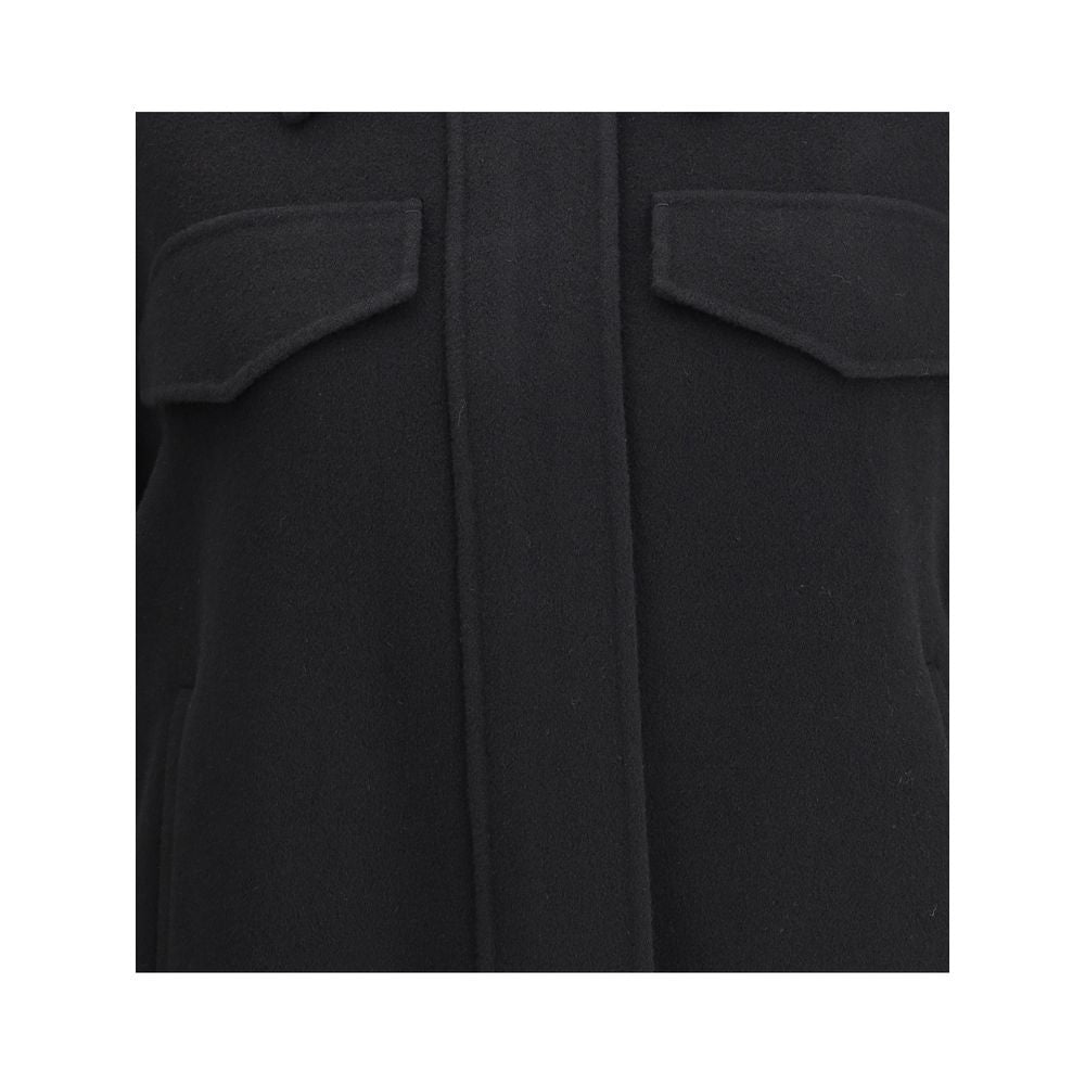 Close-up of Max Mara Black Wool Cloacks showing the contoured flap pockets and wool double drap texture.