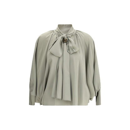 Max Mara Green Silk Blouse with batwing sleeves, V-neck bow-tie, jewel loop, asymmetrical hem, and side button cuffs for AW25 season.
