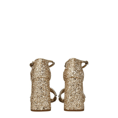 Miu Miu Gold Plastic Platform Sandals with rhinestone details, buckle closure, open toe, and high heel, viewed from the back.