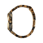 Side view of NIXON WATCHES Mod. A327-3346 showing acetate strap and gold-tone case, designed for ladies, quartz movement, water resistant.